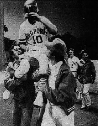 Jerry Jones is carried off the field by fans