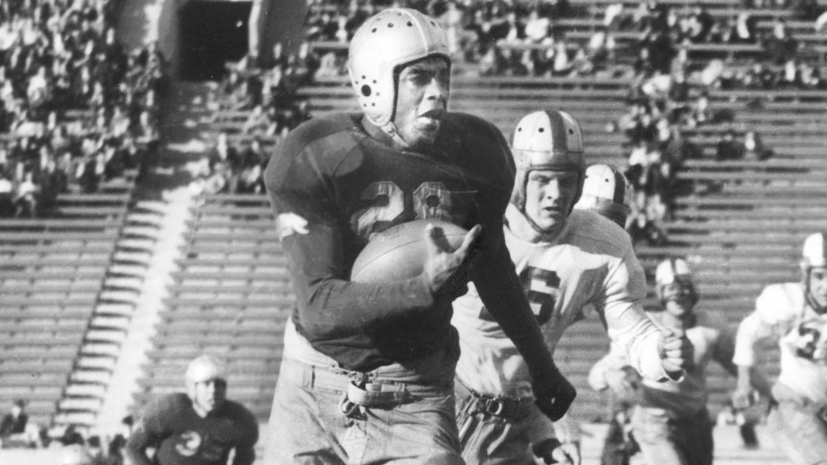 Jackie Robinson wore No. 28 for UCLA's football team. In this file photo, he's playing for the Bruins against Stanford.