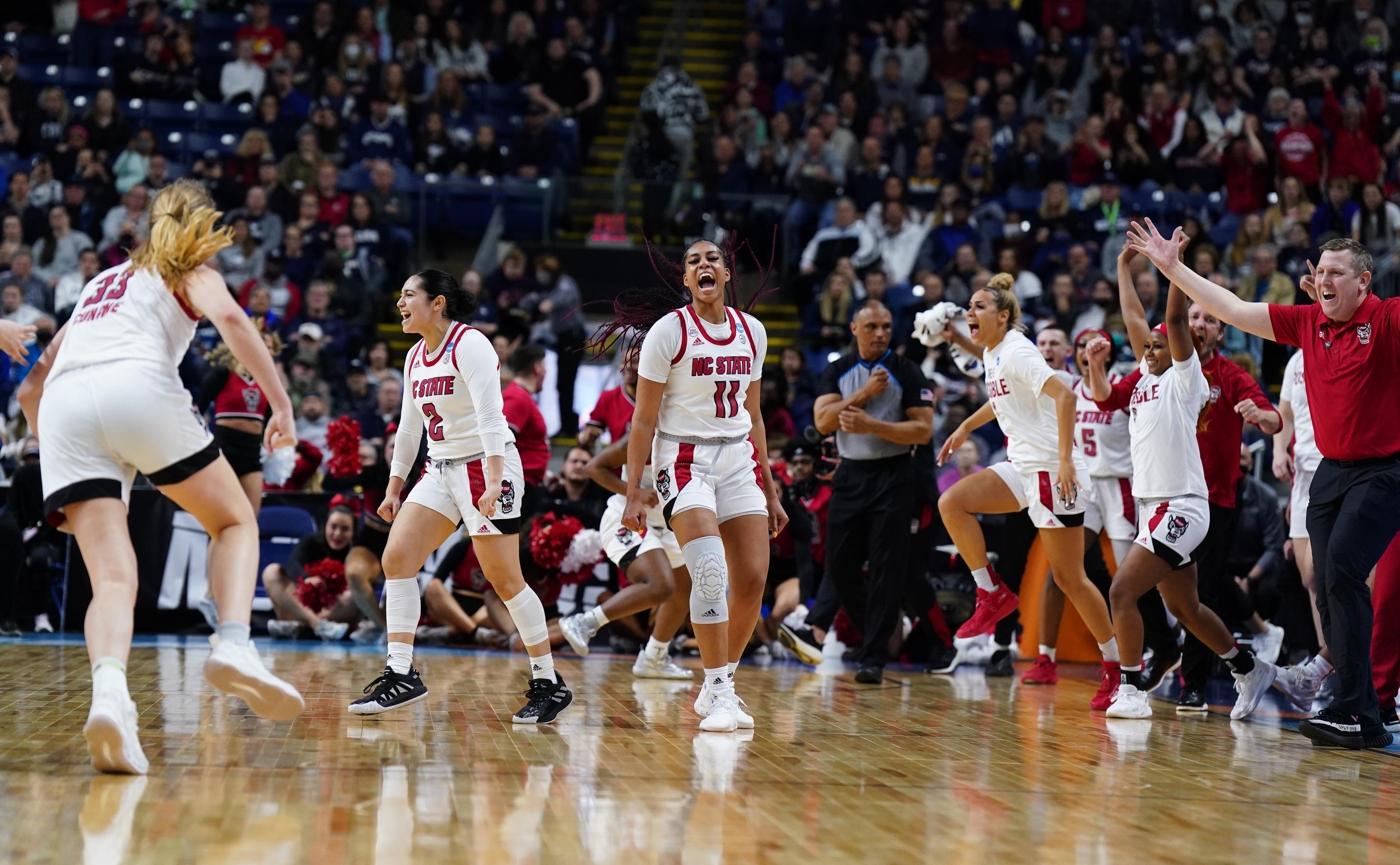 The NC State Wolfpack celebrate defeating the Notre Dame Fighting Irish at Webster Bank Arena.