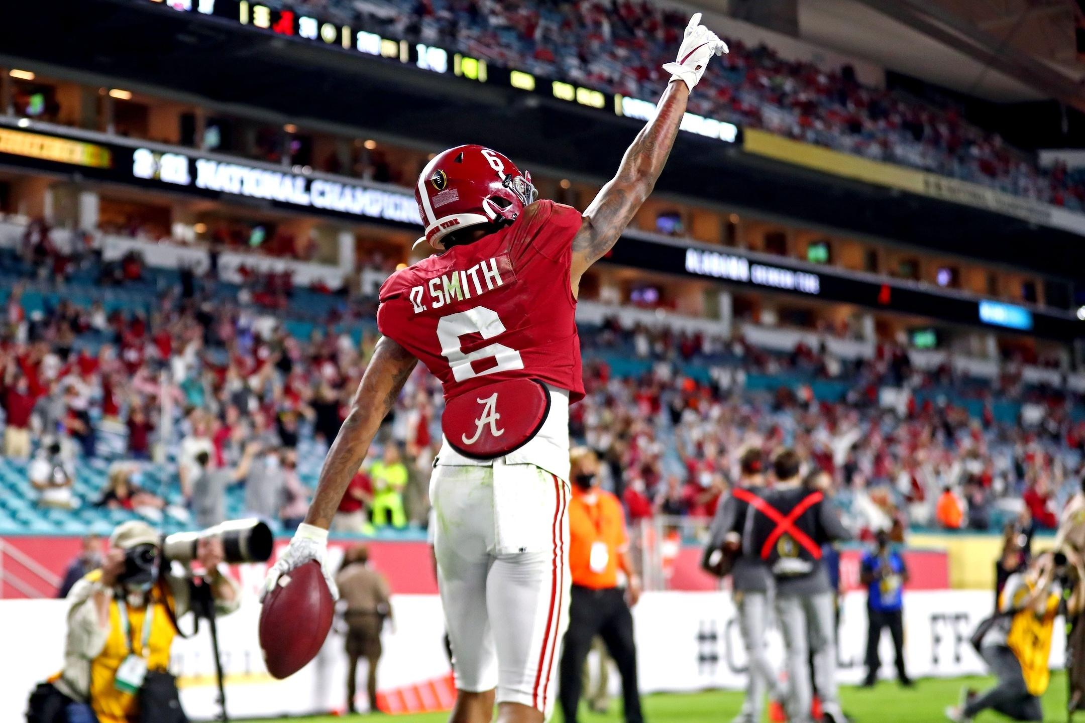 Devonta Smith points after touchdown