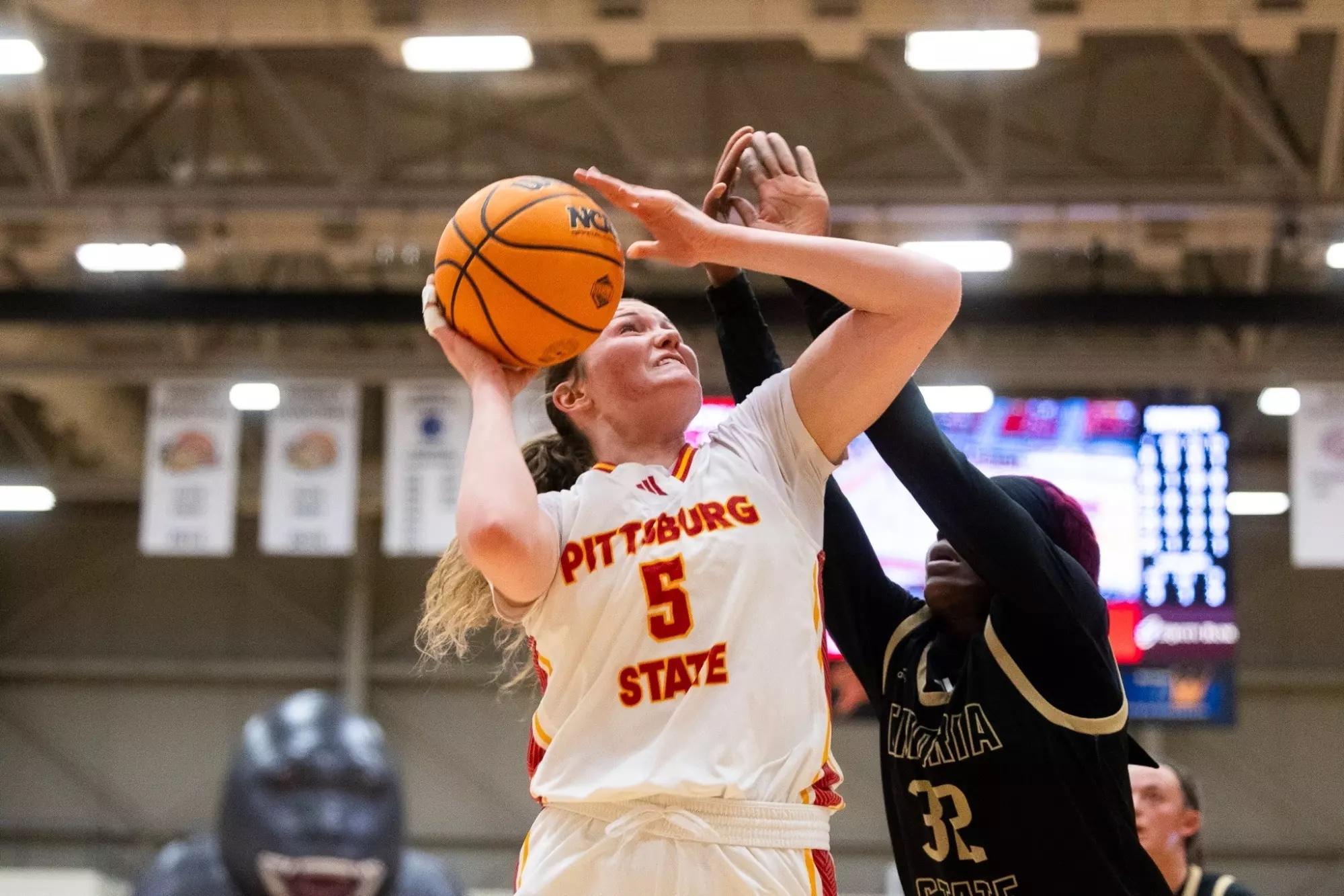 Karenna Gerber jumps with elation for the 6-1 Pitt State Gorillas. 