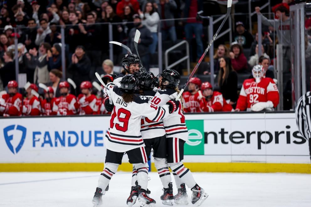 The Northeastern Huskies celebrate a goal in the 2025 Women's Beanpot final against Boston University
