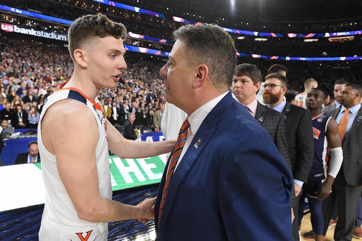 Kyle Guy and Bruce Pearl shake hands following the game